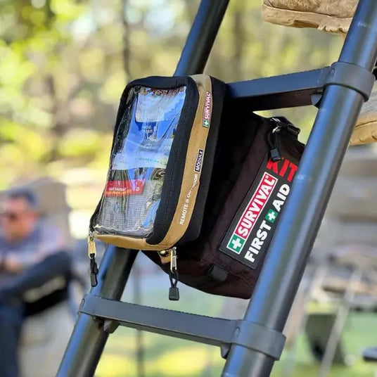 SURVIVAL Travel First Aid KIT hanging from roof top tent ladder.