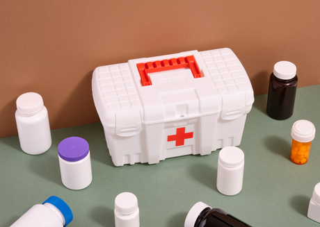 White first aid kit with red cross