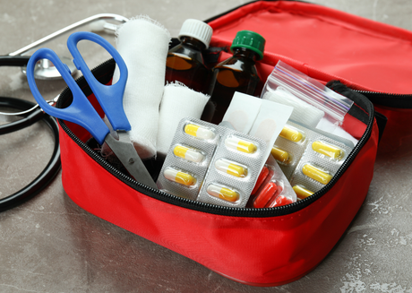 First aid kit with medical pills and medical bottles 