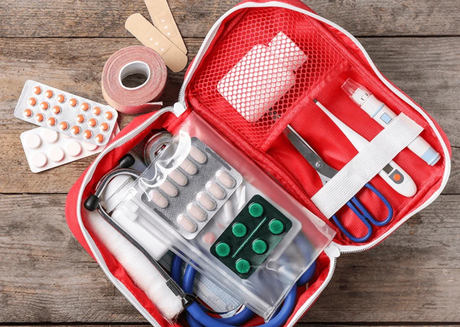 Open first aid kit with supplies