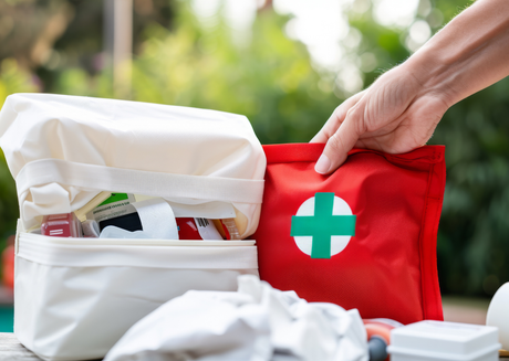 Open white bag with bandages and gauze outdoors