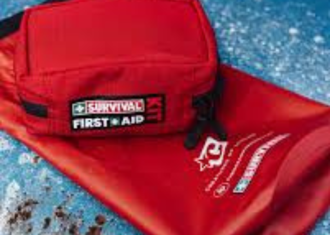 Red Survival First Aid Kit on a red dry bag