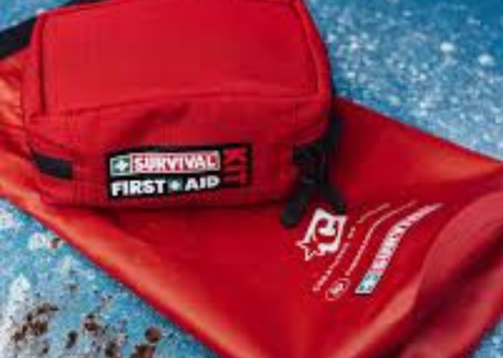 Red Survival First Aid Kit on a red dry bag