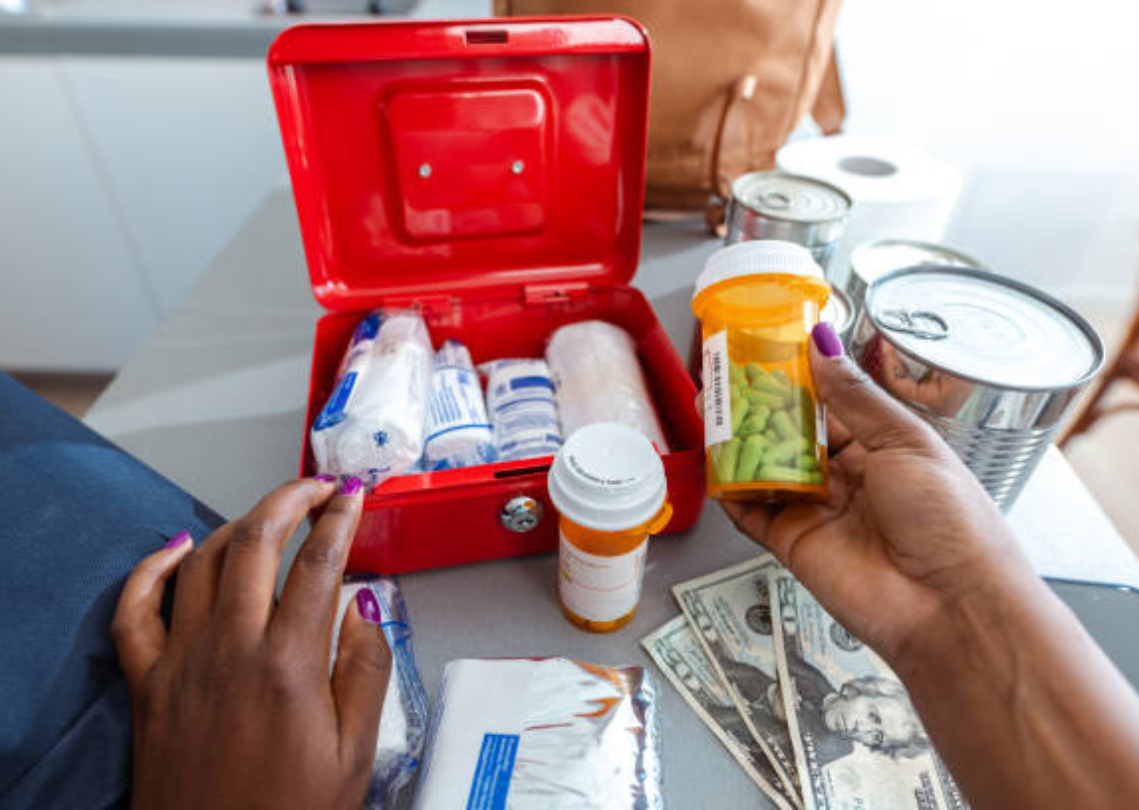 Prescription pills and medical supplies with cash on a table