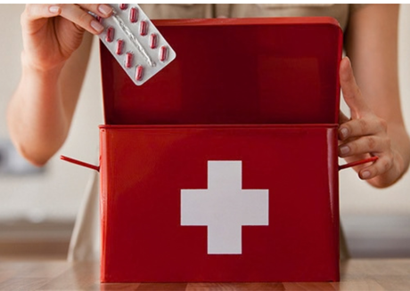 Person placing capsules into emergency kit