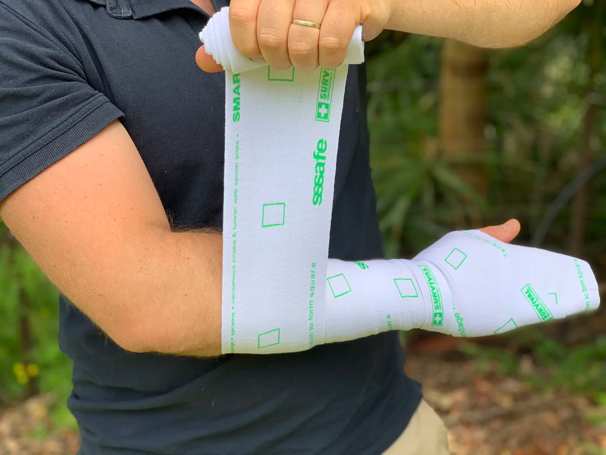 SMART Bandage wrapped up a forearm, its printed rectangles stretched into squares