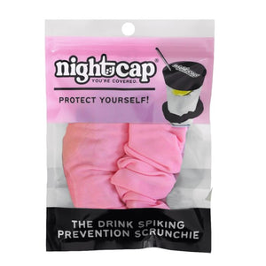 NightCap drink spiking prevention scrunchie in pink, in its pack