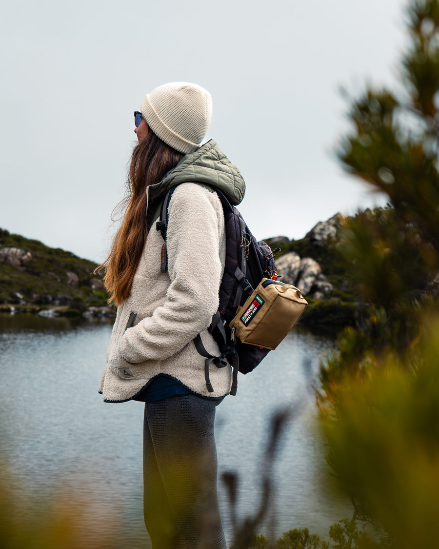 Hiker with the Snake Bite KIT clipped to her backpack