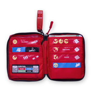 SURVIVAL Trail First Aid KIT open, showing colour-coded labelled pockets, Gen 8 pictograms and the whistle on the zip pull